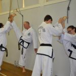 Black belts have trained to become strong and flexible